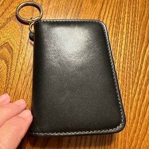 Coach women’s wallet. Black w brown interior. Change pocket. Gently used.